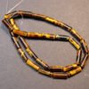 Cylinderformede perler i Tigereye 4x14 mm